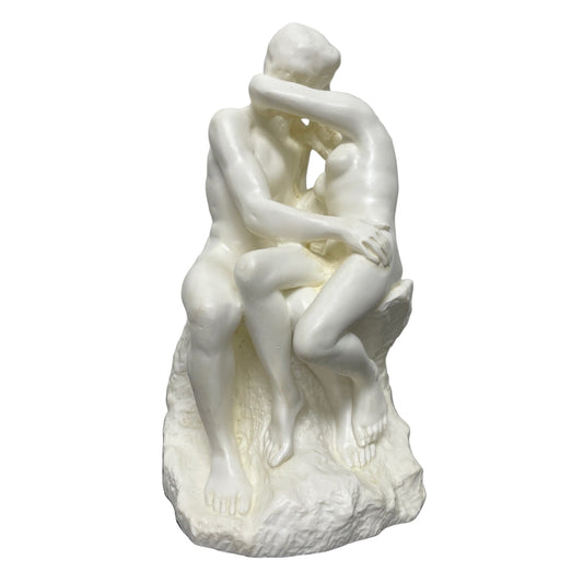 Front view Rodin The Kiss statue with lovers in a tender embrace.