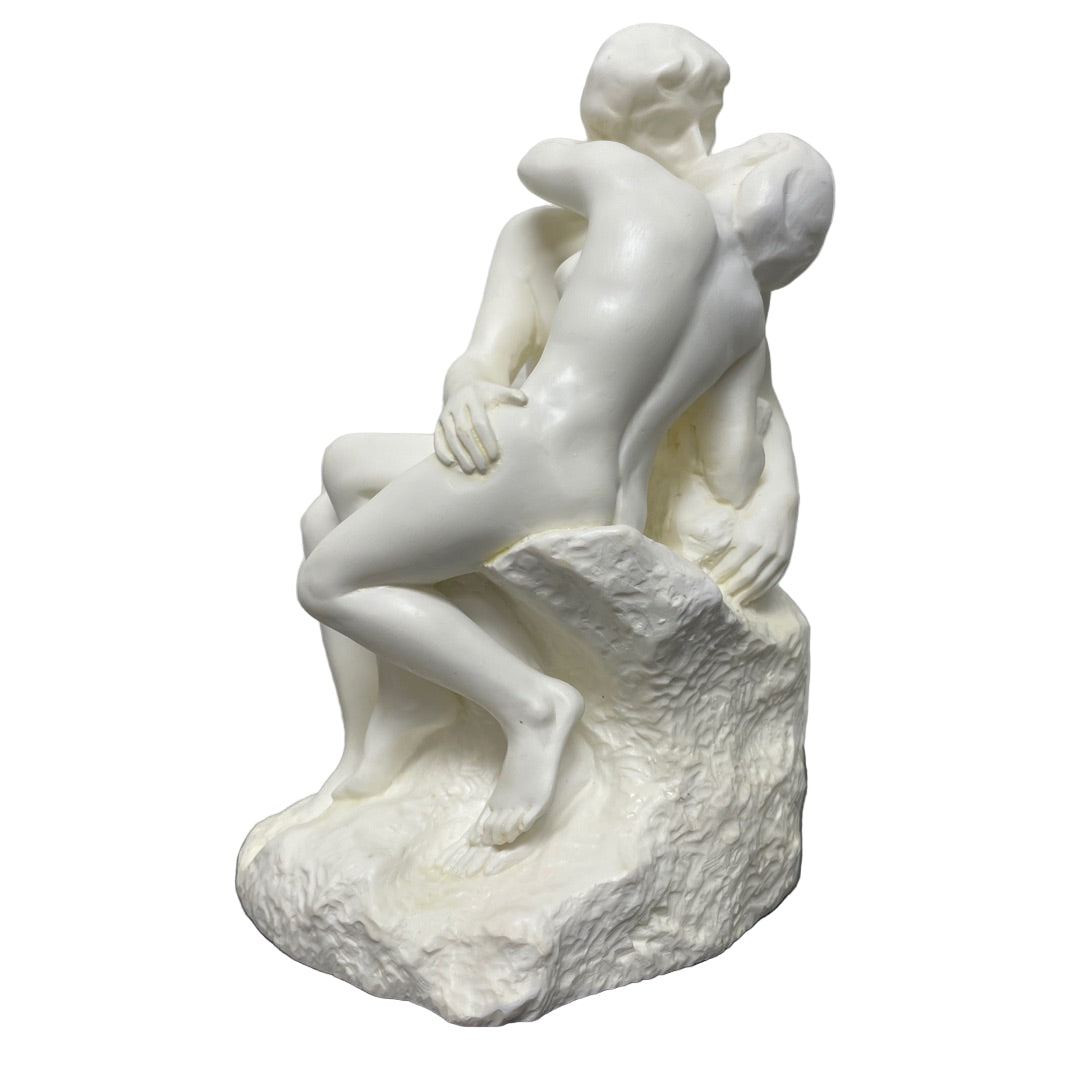 Side view Rodin The Kiss statue with lovers in a tender embrace.