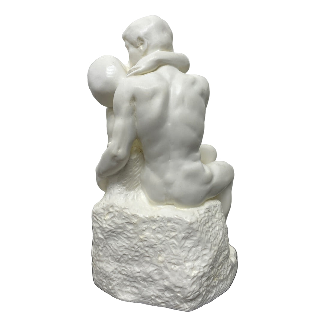 Desk-size white Rodin The Kiss statue with lovers in a tender embrace.