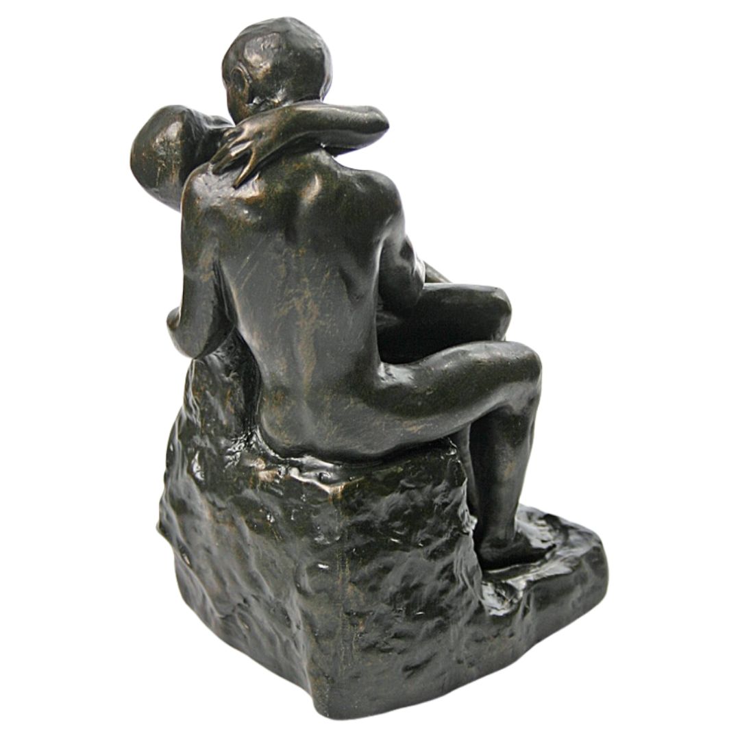 Small Rodin The Kiss sculpture showing tender lovers embrace.