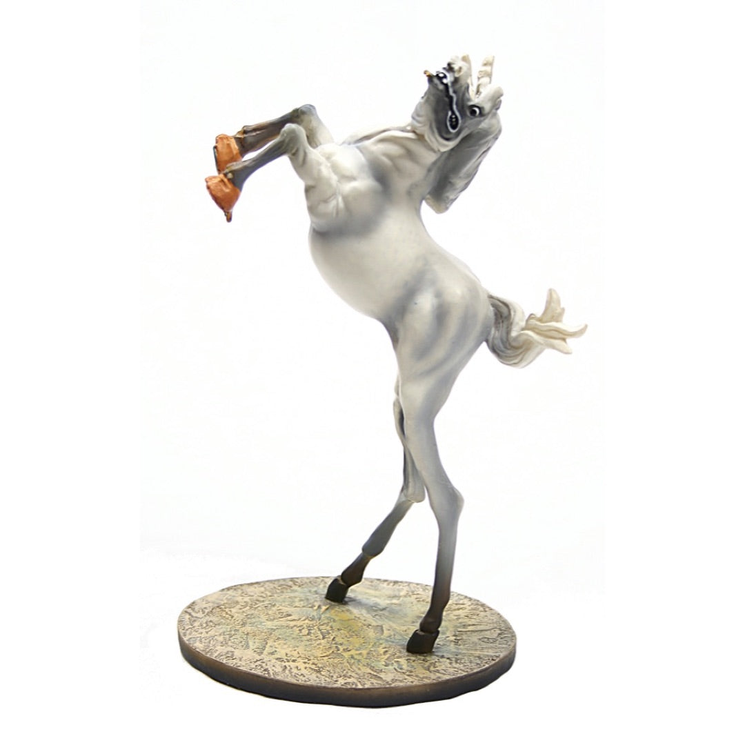 Full view of Dalí Rearing Horse statue with surreal elongated legs and base.