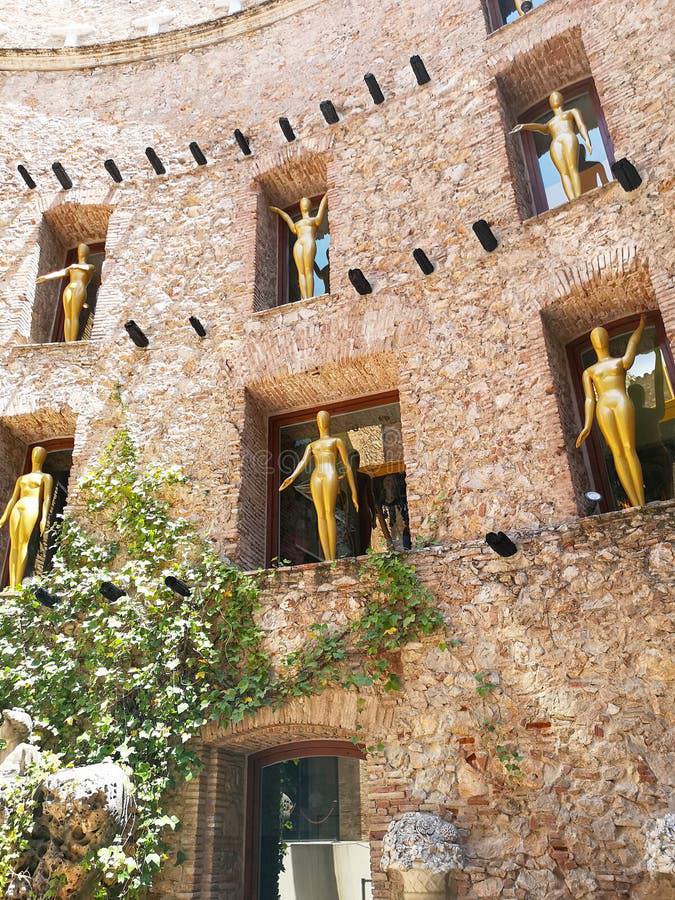 Dalí Welcome Statue – Gold Surreal Figurine on Tire from Dali Theater