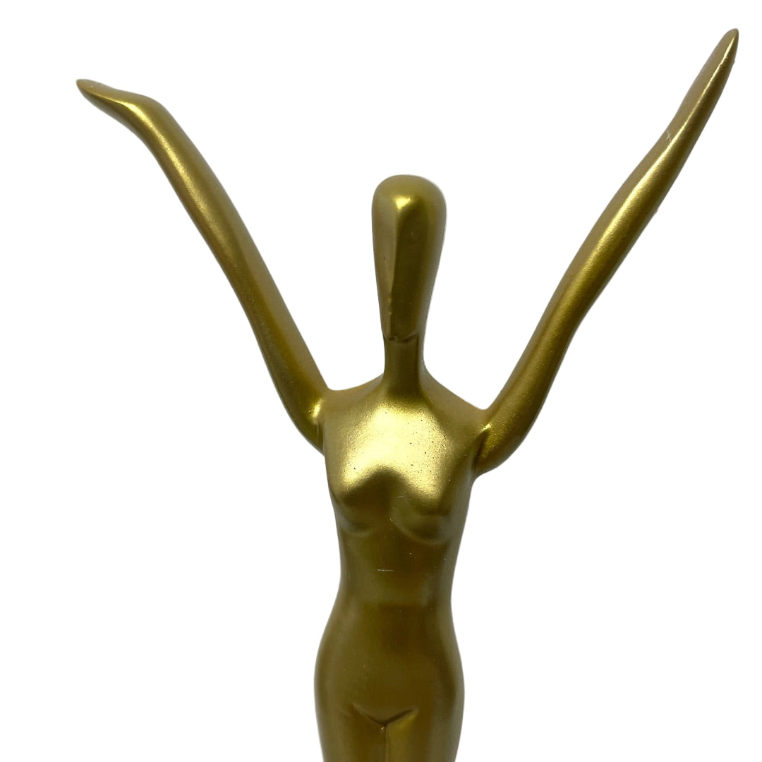 Close-up of Salvador Dalí “Welcome Statue” torso and raised hands highlighting metallic texture and surrealist design details