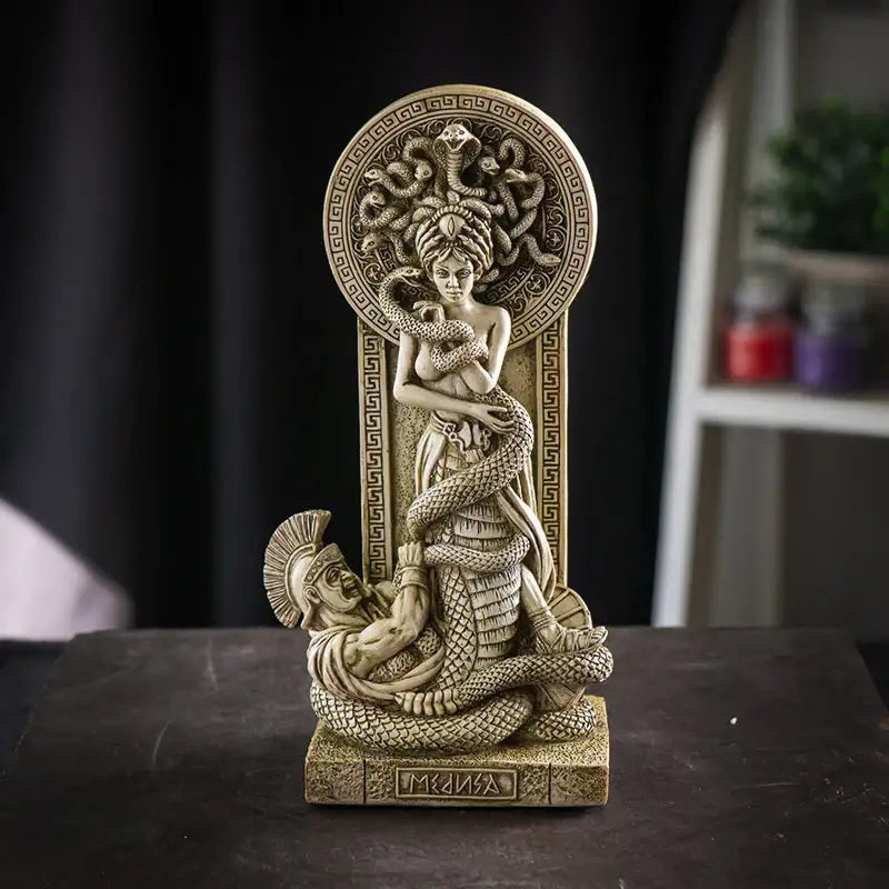 Medusa desk sculpture showing tension between goddess and Greek soldier