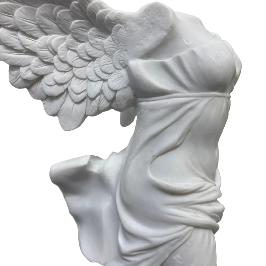 Winged Victory of Samothrace collectible statue showing flowing draped robes and outstretched wings, white finish