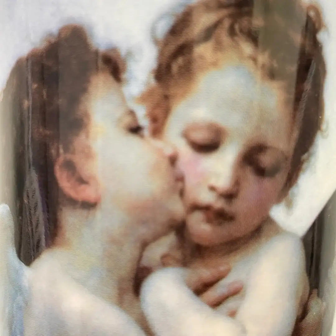 Close-up of Bouguereau cherub embrace on cylindrical art vase