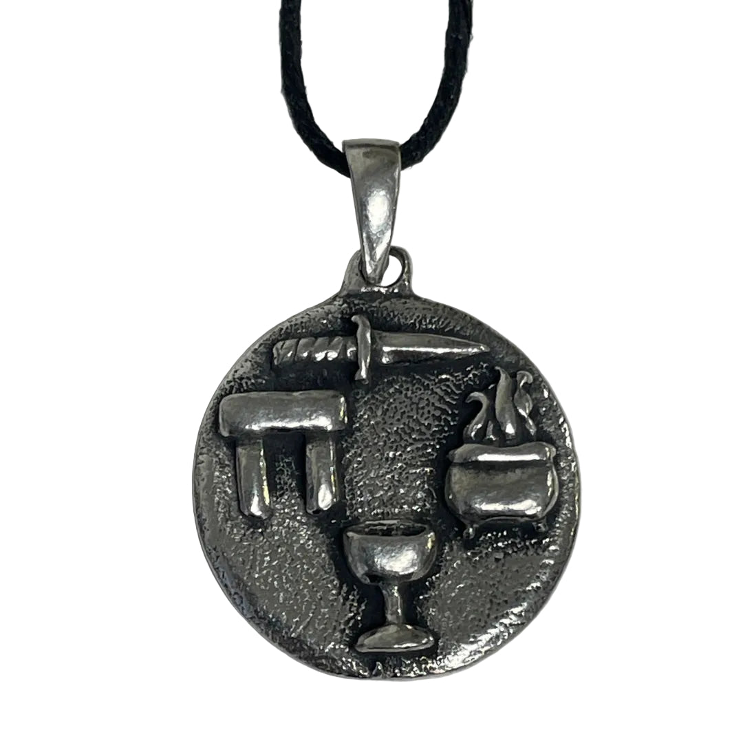 A silver-toned circular pendant necklace featuring raised symbols of the Wiccan Triple Goddess (trident, sword, chalice, and cauldron)