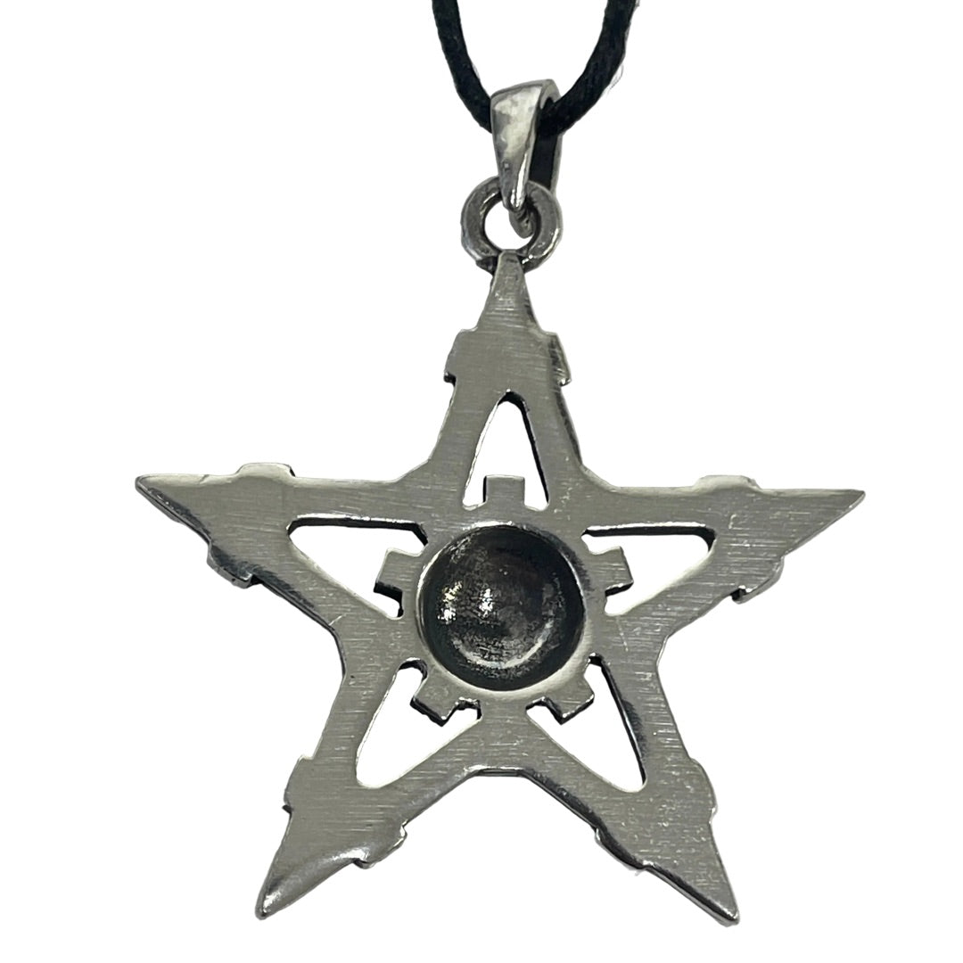 A silver-toned five-pointed star pendant necklace with a central dark circular element, hanging from a black cord against a plain white background.